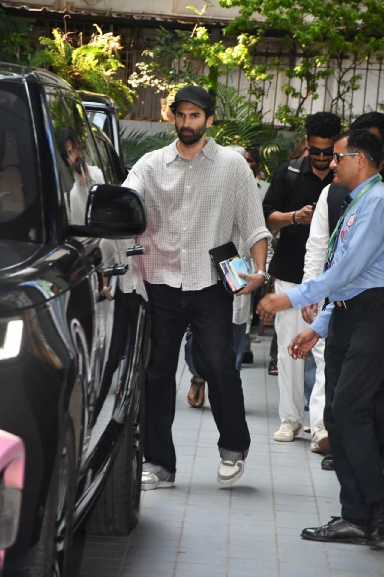 Aditya Roy Kapur opted for a laid-back look during his latest outing. The actor was seen in an oversized beige checked shirt paired with black trousers.